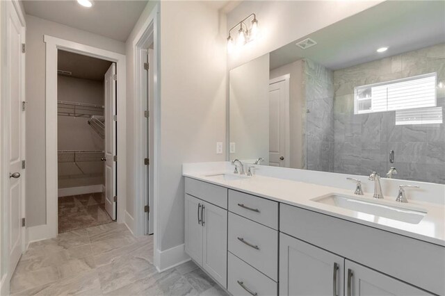 bathroom with walk in shower and ceiling fan