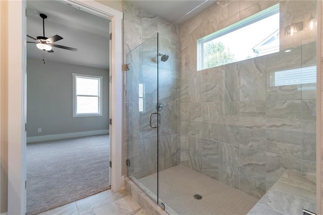 329 Willow Cv, Canton, GA 30114 - bathroom featuring a stall shower, ceiling fan, baseboards, and a wealth of natural light