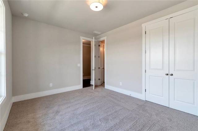 329 Willow Cv, Canton, GA 30114 - unfurnished bedroom with a closet, baseboards, and carpet