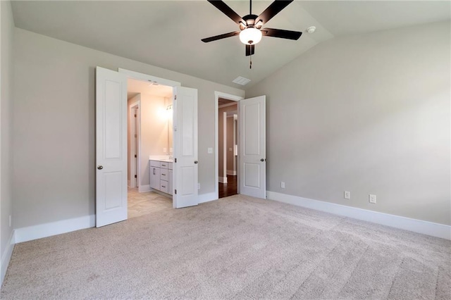 329 Willow Cv, Canton, GA 30114 - unfurnished bedroom with ceiling fan, visible vents, vaulted ceiling, light carpet, and baseboards