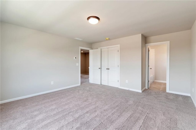329 Willow Cv, Canton, GA 30114 - unfurnished bedroom with a closet, baseboards, and carpet floors
