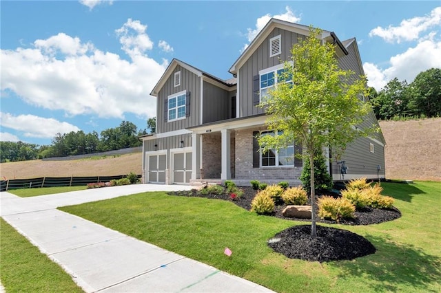 craftsman-style home with a garage and a front lawn