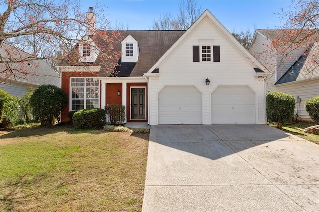 view of front facade featuring driveway and a front lawn