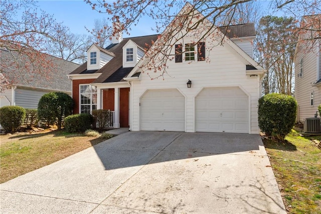 view of front facade with a garage, brick siding, central AC unit, and driveway