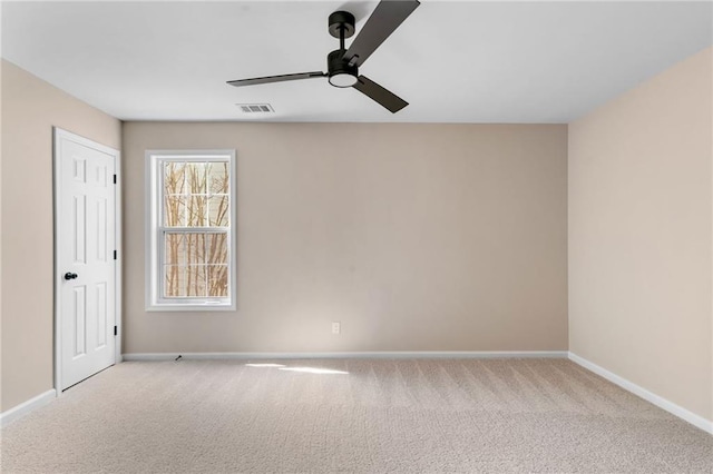 empty room featuring visible vents, baseboards, ceiling fan, and carpet flooring