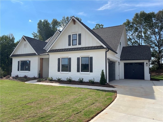 view of front facade featuring a front lawn and a garage