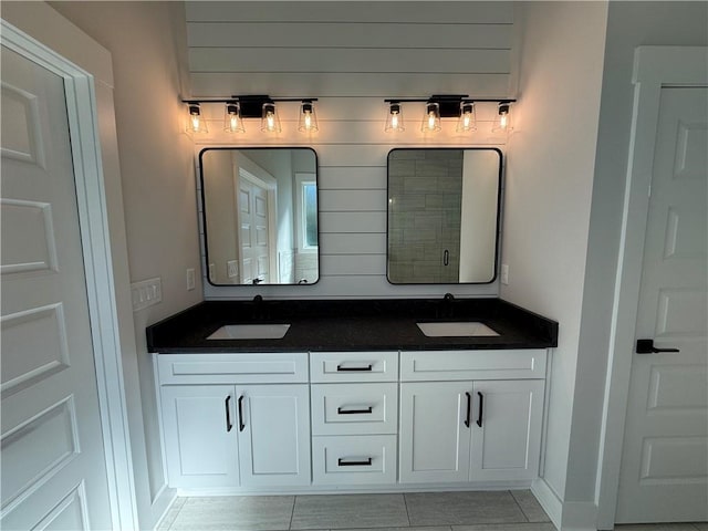 bathroom with tile patterned flooring and vanity