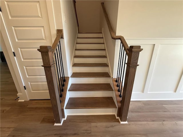 stairs with hardwood / wood-style flooring