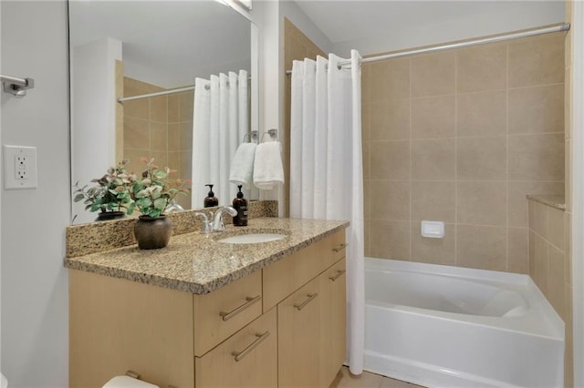 full bathroom with tile patterned flooring, vanity, shower / bathtub combination with curtain, and toilet