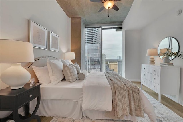 bedroom featuring hardwood / wood-style floors and ceiling fan