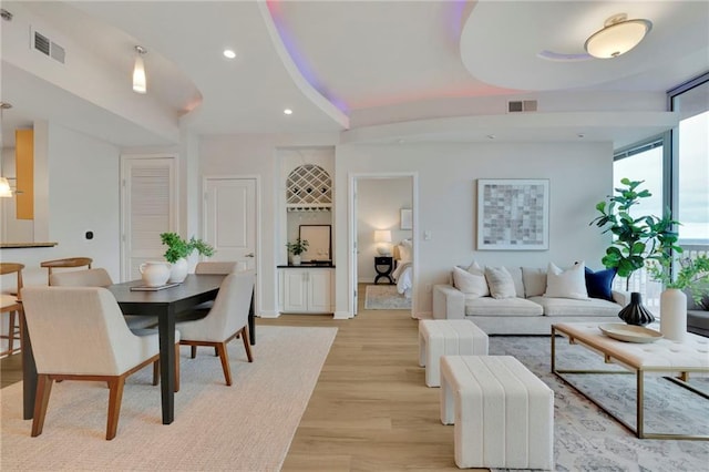 living room with light hardwood / wood-style flooring