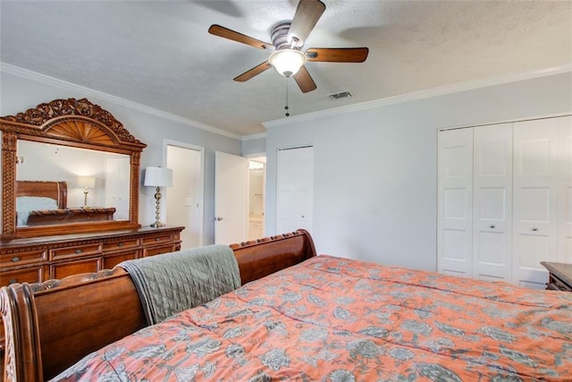 bedroom featuring multiple closets, crown molding, and ceiling fan