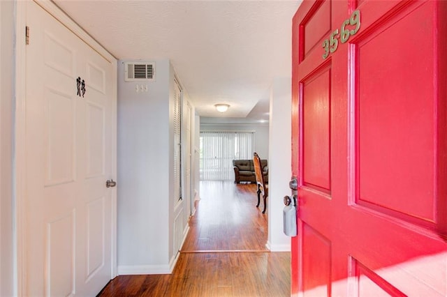 entrance foyer with hardwood / wood-style floors