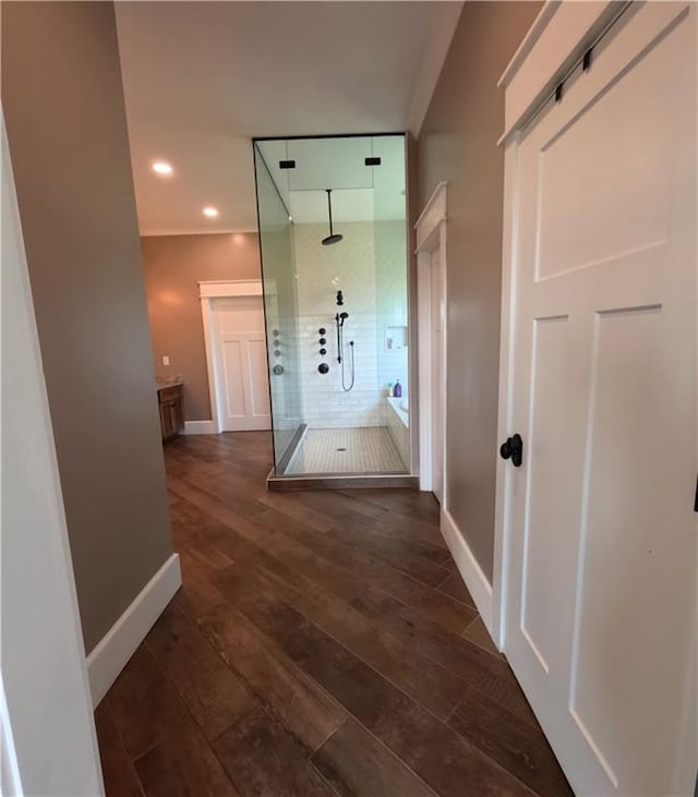 corridor featuring dark hardwood / wood-style floors