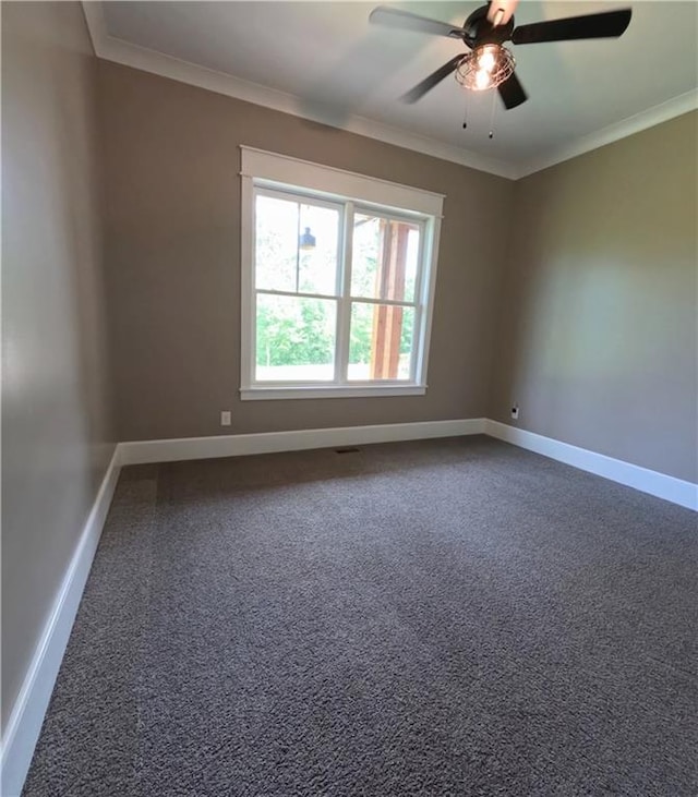 empty room featuring ceiling fan, crown molding, and carpet floors