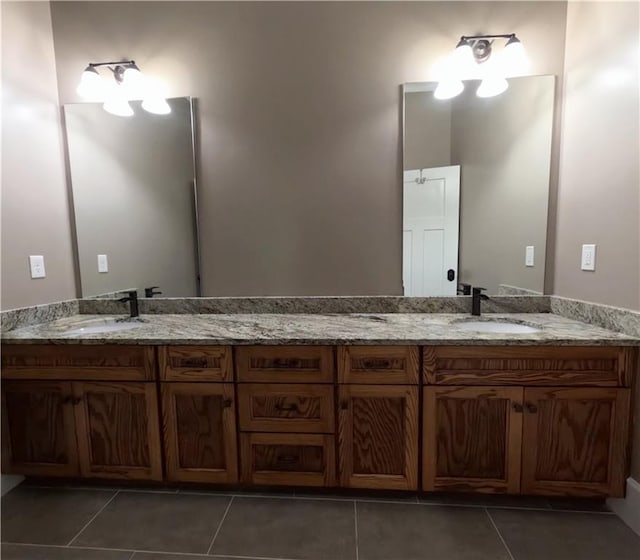 bathroom featuring dual vanity and tile patterned floors