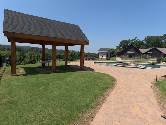 view of property's community featuring a patio, a swimming pool, a gazebo, and a yard