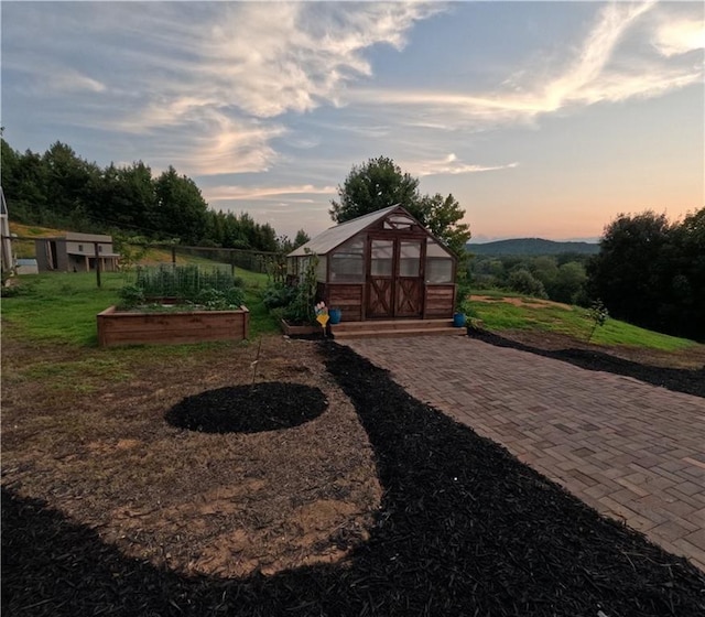 yard at dusk with an outdoor structure