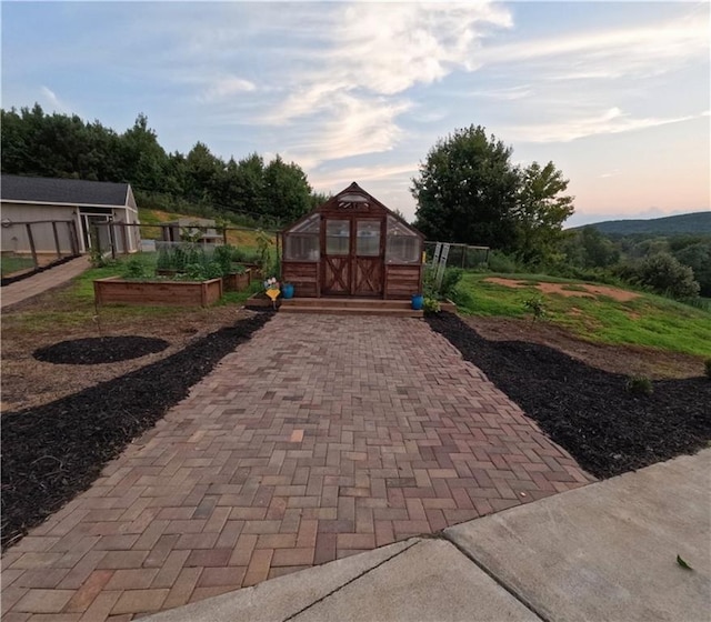 patio terrace at dusk with an outbuilding