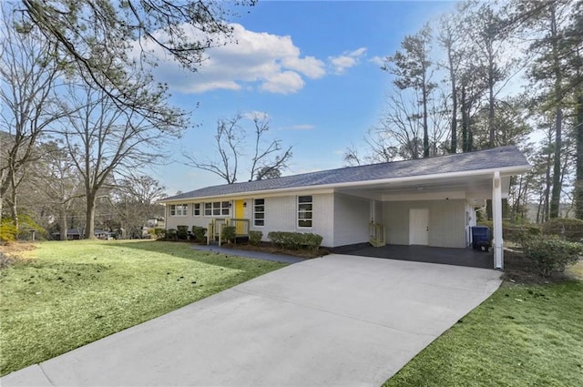 ranch-style house featuring driveway, a front lawn, a carport, and brick siding