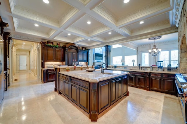 595 S Mount Carmel Rd, Mcdonough, GA 30253 - kitchen with a center island with sink, coffered ceiling, beamed ceiling, ornamental molding, and a chandelier