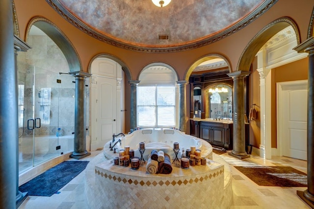 bathroom featuring vanity, ornamental molding, plus walk in shower, and decorative columns