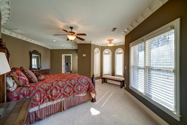 bedroom with ceiling fan and light colored carpet