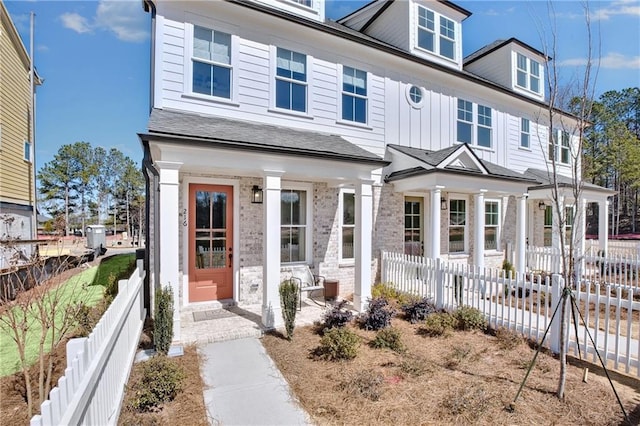 view of front of house with fence private yard and board and batten siding