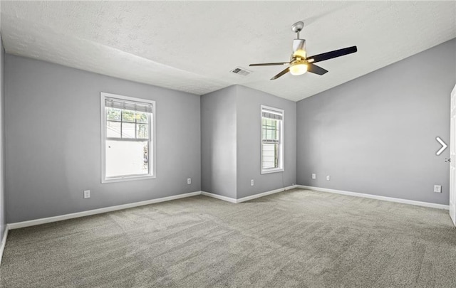 1332 Adcox Sq, Stone Mountain, GA 30088 - unfurnished room featuring carpet, a ceiling fan, baseboards, and a textured ceiling