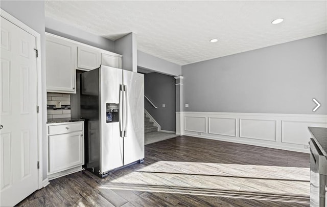 1332 Adcox Sq, Stone Mountain, GA 30088 - kitchen with stainless steel fridge, white cabinets, dark countertops, dark wood finished floors, and recessed lighting