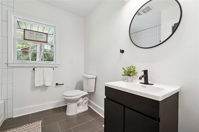 full bathroom featuring tile patterned floors, vanity, toilet, and  shower combination