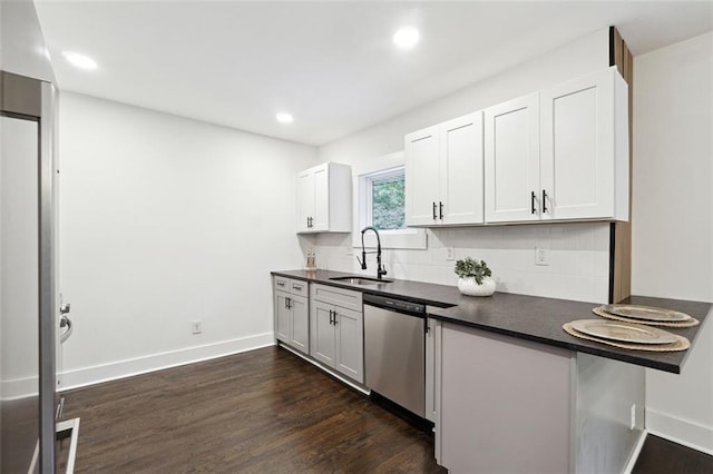 kitchen with backsplash, dishwasher, white cabinets, and sink