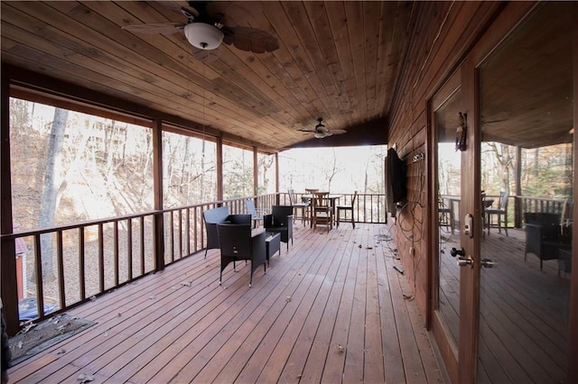 wooden terrace featuring ceiling fan