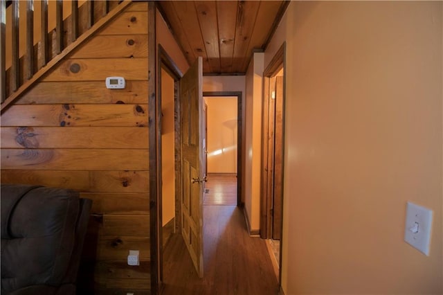 hall with dark hardwood / wood-style floors and wooden ceiling