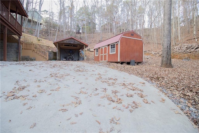 view of property exterior featuring a storage shed