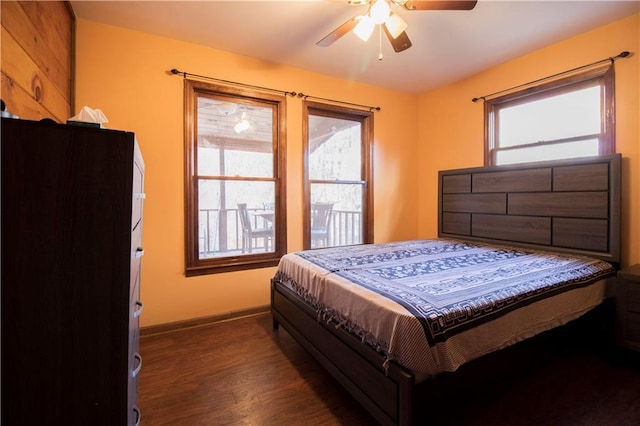 bedroom featuring ceiling fan and dark wood-type flooring