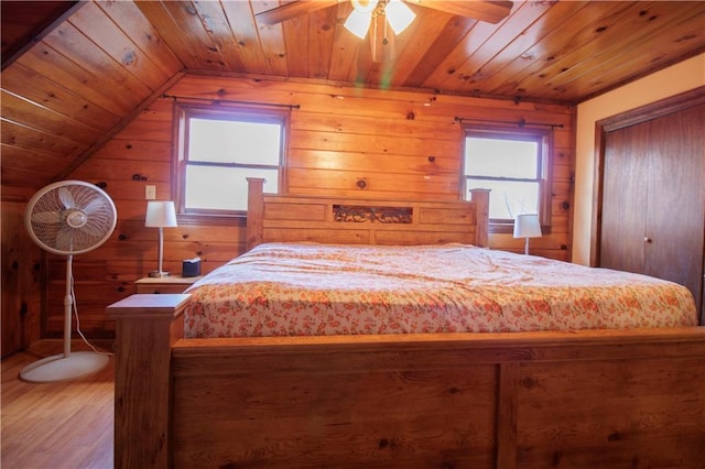 bedroom featuring wood-type flooring, ceiling fan, lofted ceiling, and wood ceiling