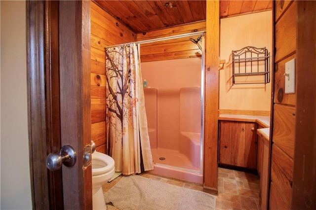 bathroom with vanity, wooden ceiling, wooden walls, a shower with shower curtain, and toilet