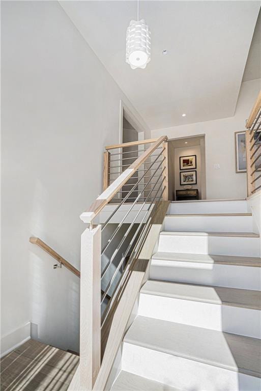 stairway featuring hardwood / wood-style flooring