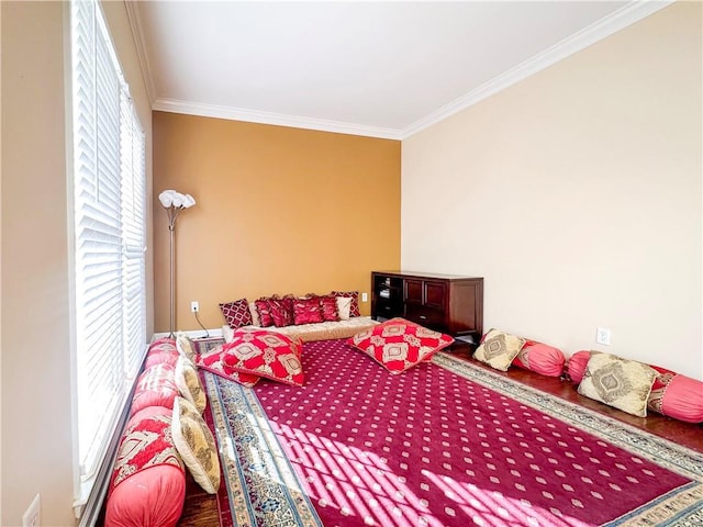 bedroom with hardwood / wood-style flooring and ornamental molding