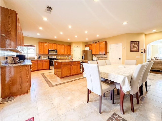 tiled dining area with sink