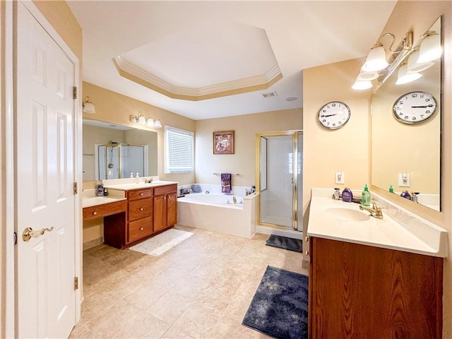 bathroom featuring crown molding, vanity, shower with separate bathtub, and a raised ceiling