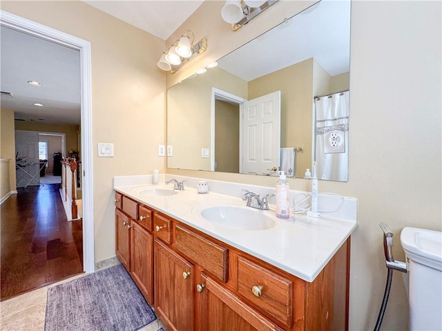 bathroom featuring tile patterned flooring and vanity