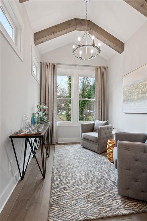 4200 Legacy Ln Unit 22, Acworth, GA 30101 - living area featuring healthy amount of natural light, a chandelier, baseboards, and wood finished floors