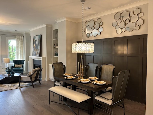 4200 Legacy Ln Unit 22, Acworth, GA 30101 - dining room featuring dark wood finished floors, crown molding, built in features, a decorative wall, and a fireplace