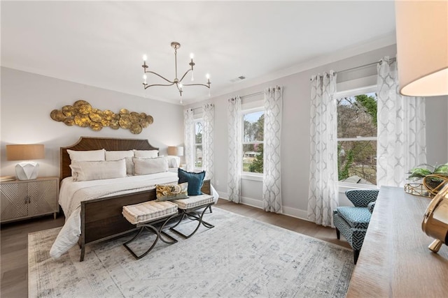 4200 Legacy Ln Unit 22, Acworth, GA 30101 - bedroom with a chandelier, baseboards, wood finished floors, and ornamental molding