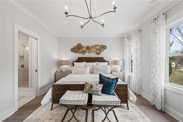 4200 Legacy Ln Unit 22, Acworth, GA 30101 - bedroom featuring a chandelier, connected bathroom, wood finished floors, and baseboards