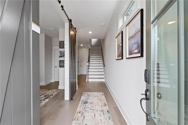 4200 Legacy Ln Unit 22, Acworth, GA 30101 - corridor featuring a barn door, light wood-style floors, recessed lighting, stairs, and baseboards