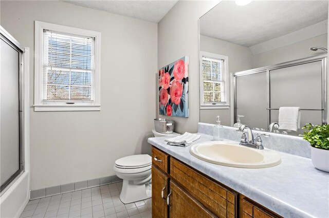 full bathroom featuring baseboards, tile patterned floors, toilet, and vanity