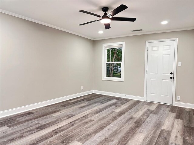 unfurnished room with ornamental molding, ceiling fan, and hardwood / wood-style flooring